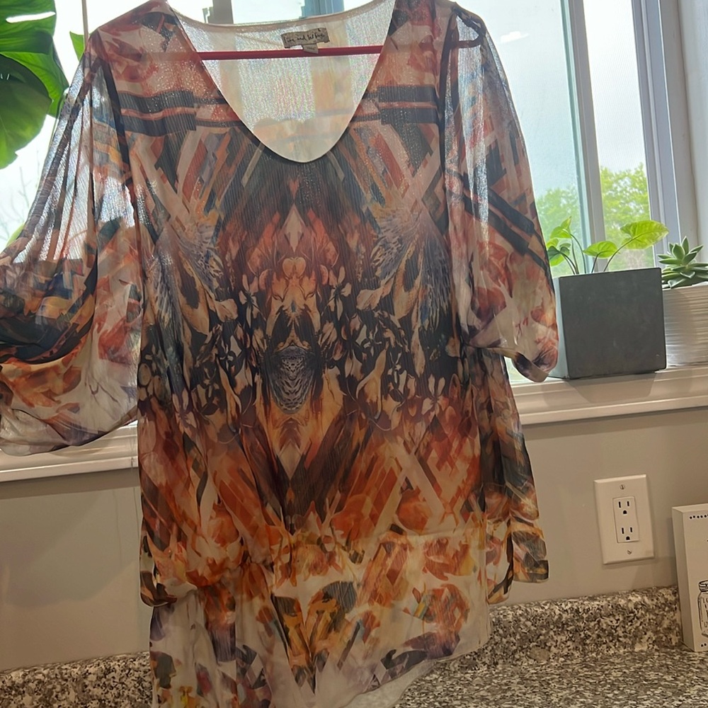 Pretty top size large- multicolor but mostly orange